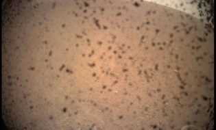 NASA's InSight Mars lander acquired this image of the area in front of the lander using its lander-mounted, Instrument Context Camera (ICC). This image was acquired on Nov. 26, 2018, Sol 0 of the InSight mission where the local mean solar time for the image exposures was 13:34:21. Each ICC image has a field of view of 124 x 124 degrees.